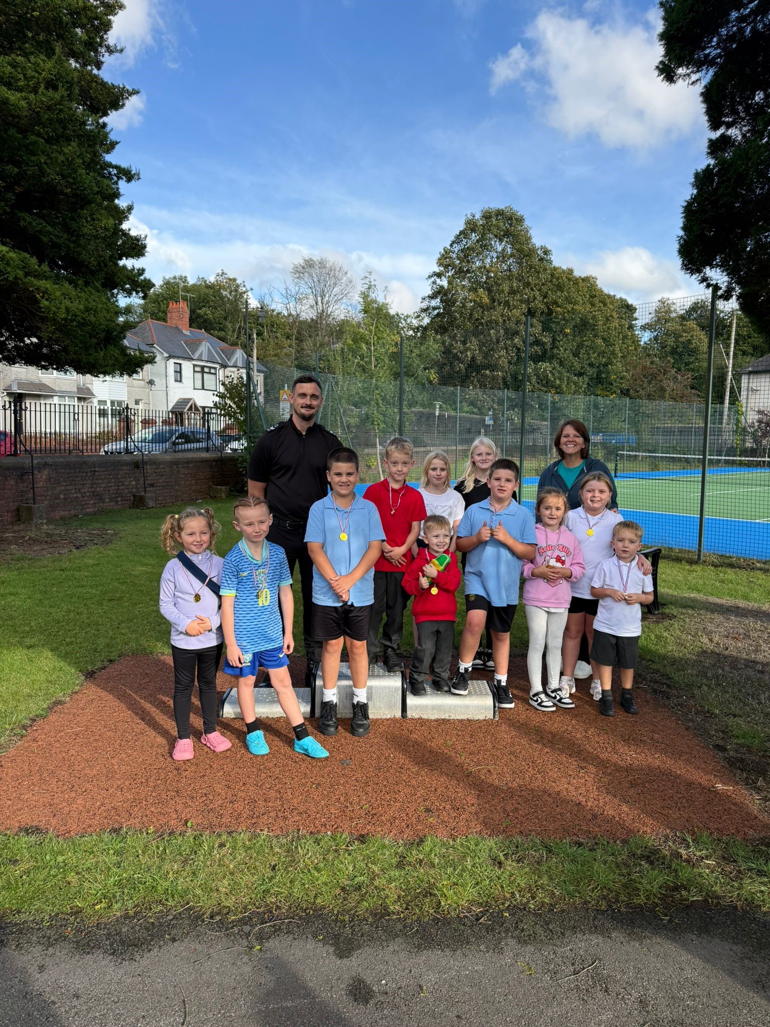 Insp Thompson with tennis group.jpg